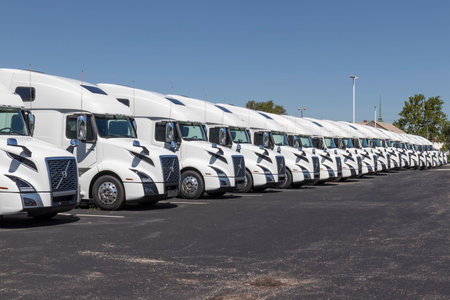 Indianapolis - Circa August 2020: Volvo Semi Tractor Trailer Trucks Lined up for Sale. Volvo is one...