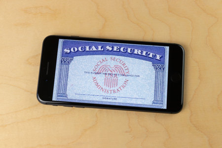 Indianapolis - Circa August 2020: Social Security card blank on a smartphone. The Social Security...