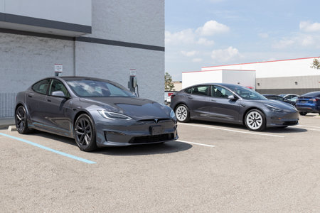 Indianapolis - Circa August 2021: Tesla Model 3 and Model S EV electric vehicles on display. Tesla products include electric cars, battery energy storage and solar panels.のeditorial素材