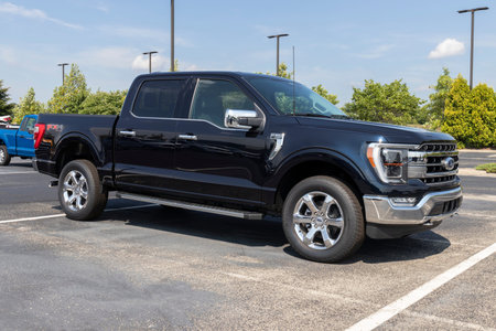 Indianapolis - Circa August 2021: Ford F-150 display at a dealership. The Ford F150 is available in...