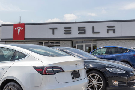 Indianapolis - Circa August 2021: Tesla EV electric vehicles on display. Tesla products include...