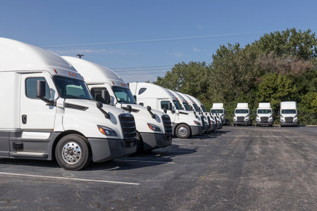 Indianapolis - Circa September 2021: Freightliner Semi Tractor Trailer Trucks Lined up for sale. Freightliner is owned by Daimler.のeditorial素材