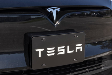 Indianapolis - Circa October 2021: Tesla EV electric vehicles logo. Tesla products include electric cars, battery energy storage and solar panels.のeditorial素材