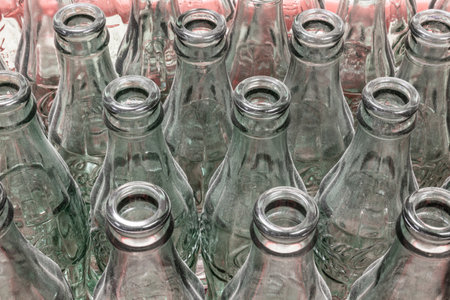 Indianapolis - Circa November 2021: Traditional Coke bottles in a row. Coca Cola has been using the patented Coke-Bottle since 1915.のeditorial素材
