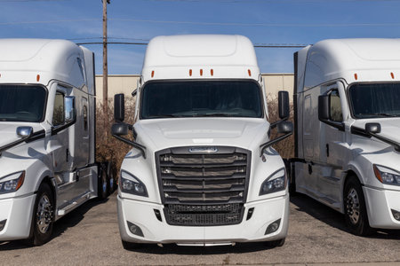 Cincinnati - Circa December 2021: Freightliner Semi Tractor Trailer Trucks Lined up for sale. Freightliner is owned by Daimler.のeditorial素材