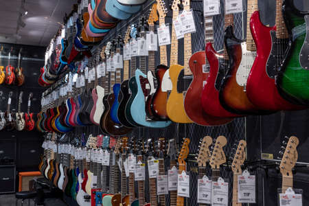 Indianapolis - Circa March 2022: Electric Guitar display at Guitar Center. Selling brands like Fender, Gibson and Ibanez, Guitar Center is a retailer of musical instruments.のeditorial素材