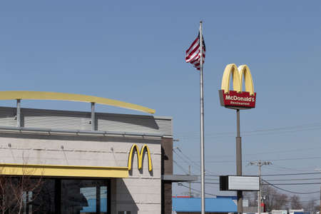 Brownsburg - Circa March 2022: McDonald's Restaurant. McDonald's is offering employees higher hourly wages, paid time off, backup child care and tuition payments.のeditorial素材