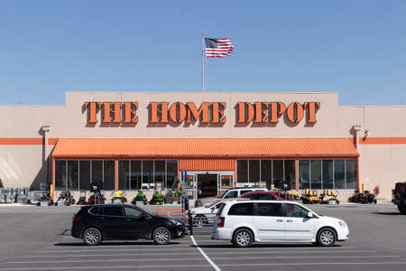 Logansport - Circa April 2022: Home Depot location with American flag. Home Depot is the largest home improvement retailer in the US.のeditorial素材