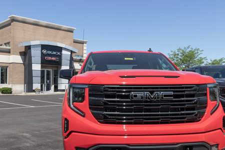 Carmel - Circa June 2022: GMC Sierra 1500 pickup display at a dealership. GMC offers the Sierra in...