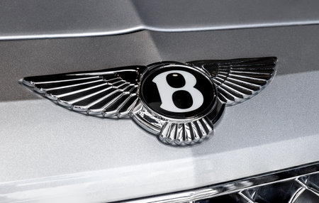 Indianapolis - Circa July 2022: Bentley logo in a stacked exposure. Bentley Motors is a British manufacturer of luxury cars and SUVs and a subsidiary of Volkswagen.のeditorial素材