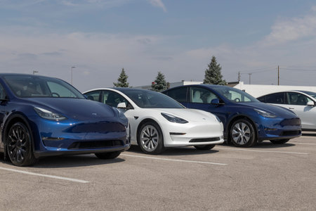 Indianapolis - Circa September 2022: Tesla EV electric vehicles on display. Tesla products include...