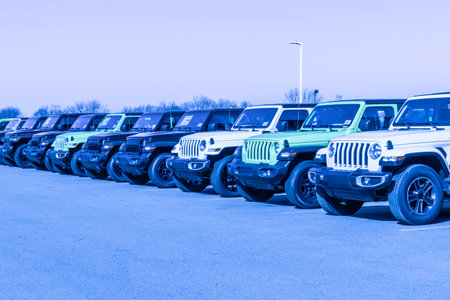 Lafayette - Circa February 2023: Jeep Wrangler display at a dealership with exaggerated colors. Jeep is part of Stellantis.のeditorial素材