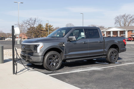 Kokomo - Circa February 2023: Ford F-150 Lightning display. Ford offers the F150 Lightning all-electric truck in Pro, XLT, Lariat, and Platinum models.のeditorial素材