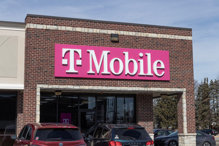 Greenwood - Circa February 2023: T-Mobile cell and mobile phone store. T-Mobile merged with Sprint to create a larger 5G internet and communications network.のeditorial素材