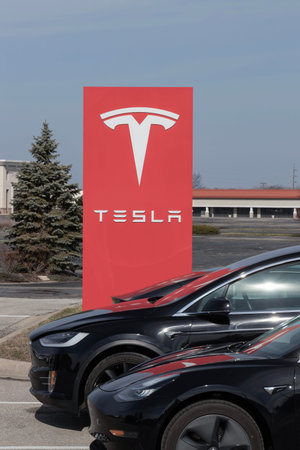 Indianapolis - Circa March 2023: Tesla EV electric vehicles on display. Tesla products include...