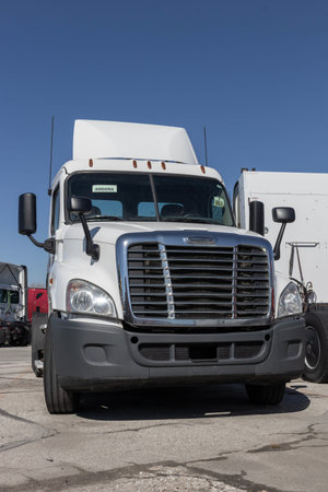 Indianapolis - Circa March 2023: Freightliner Semi Tractor Trailer Big Rig Trucks Lined up for sale. Freightliner is owned by Daimler.のeditorial素材