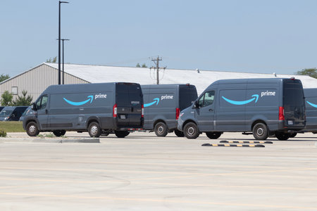 Champaign - Circa June 2023: Amazon Prime delivery van. Amazon.com is in the delivery business With...