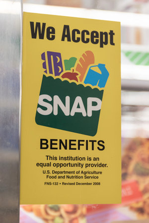 Champaign - Circa June 2023: We Accept SNAP Benefits sign. SNAP and Food Stamps provide nutrition...