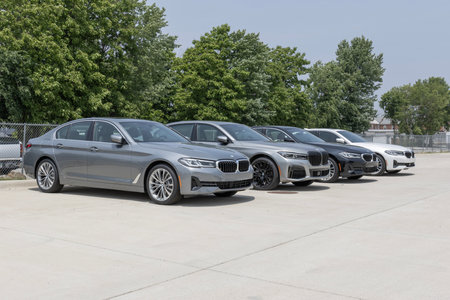 Lafayette - June 18, 2023: BMW 530i and 750i display at a dealership. BMW offers gas, electric and hybrid versions of their cars and SUVs.のeditorial素材