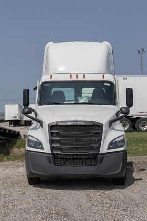Indianapolis - August 1, 2023: Freightliner Semi Tractor Trailer Trucks lined up for sale. Freightliner is owned by Daimler Trucks.のeditorial素材