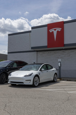 Indianapolis - August 13, 2023: Tesla EV electric vehicle charging. Tesla products include electric cars, battery energy storage and solar panels.のeditorial素材