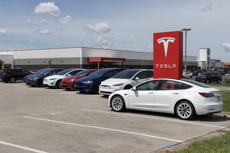 Indianapolis - August 13, 2023: Tesla EV electric vehicles on display. Tesla products include Model 3, Model X and Model Y cars and an EV charging network.のeditorial素材