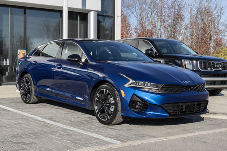 Indianapolis - November 19, 2023: Kia K5 display at a dealership. Kia offers the K5 in LX, LXS, EX, GT, and GT-Line models.のeditorial素材