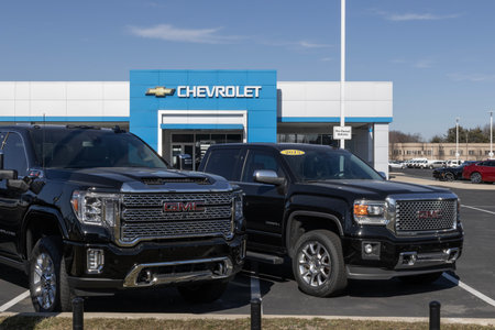Indianapolis - February 11, 2024: Used pickup truck display at a Chevrolet dealership. With supply issues, Chevy is selling pre-owned trucks to meet demand.のeditorial素材