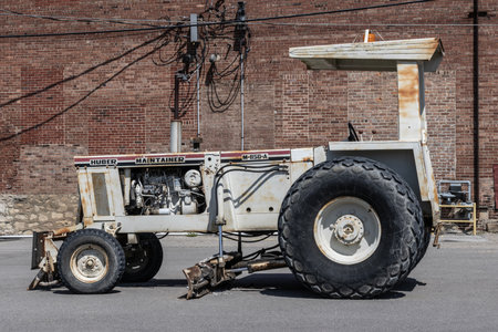 Logansport - May 2, 2024: Huber Maintainer M850A Grader. The Huber Maintainer is used for road flat grading and paving operations.のeditorial素材