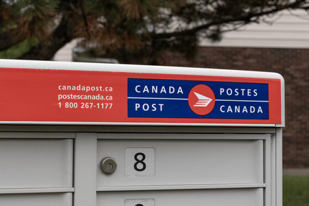 Windsor, ONT - July, 12 2024: Canada Post / Postes Canada box. Canada Post is a Crown corporation that functions as the primary mail operator in Canada.のeditorial素材