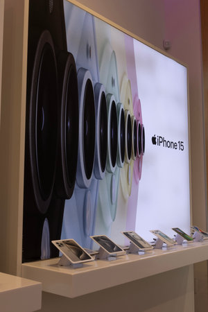 Windsor, ONT - July, 12 2024: Apple iPhone 15 display at a mobile phone cell provider store. Apple offers the iPhone 15 in base, Pro or 15 Pro Max.のeditorial素材