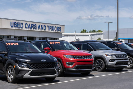 Lafayette - August 10, 2024: Used car display at a dealership. With pricing issues, used and...