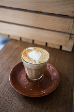 glass of hot piccolo latte coffeeの写真素材