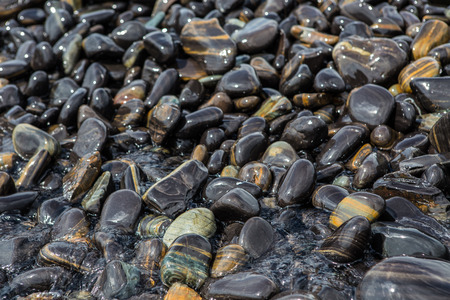 black stones beach island in Tarutao National Park,Thailandの写真素材