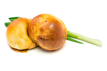Fried patties with green onion and egg. Russian traditional cousine, pirojki. Isolated on white backgroundの写真素材