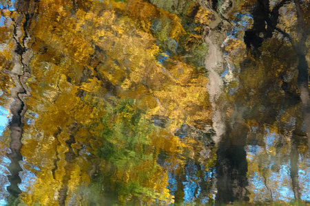 Beautiful autumn reflections in the water, in the impressionism style. Autumn on a sunny day in...