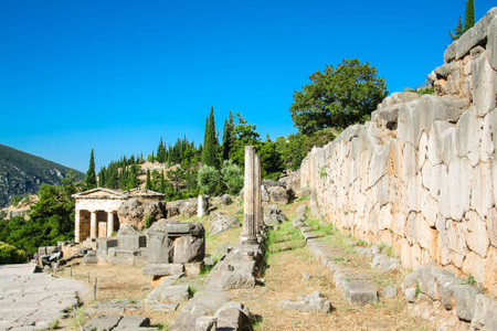 Delphi, ruins of different shrines. Fine view on archaeological site on Mount Parnassus. Greece