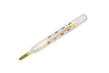 Classic medical thermometer with mercury shows high temperature. Close-up, isolated on white...