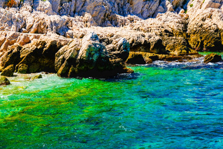 Chateau dIf, Coastal cliffs and the sea near island in the Bay of Marseille.