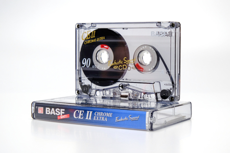 PRAGUE, CZECH REPUBLIC - JANUARY 17, 2019: Audio compact cassette Basf CE II chrome on plastic box. Audio cassette on a white background, right side view. For audio playing and recording.のeditorial素材