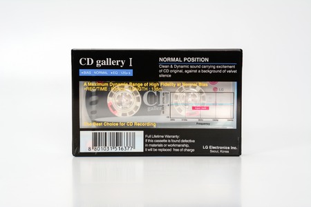 PRAGUE, CZECH REPUBLIC - NOVEMBER 29, 2018: Audio compact cassette LG CD Gallery 1. Audio cassette on a white background, back view. analog format for audio playing and recording.のeditorial素材
