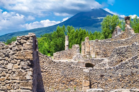 Pompeii, archeological site, Ancient ruins of dying town with view on smoking Mount Vesuvius.の写真素材