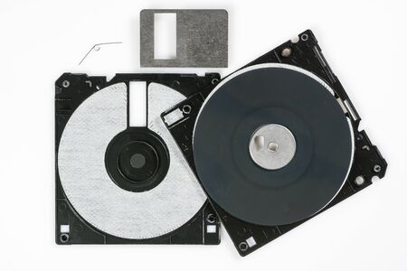 Floppy disk 3.5 inch on white backround. Disassembled vintage computer diskette, macro close-up.の写真素材