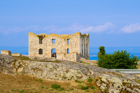 Brahehus castle. Ruins of the old Sweden castle on the granite rock between the lake and the...