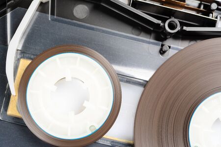 Audio cassette with one of the covers removed. You can see the precision tape drive mechanismの写真素材