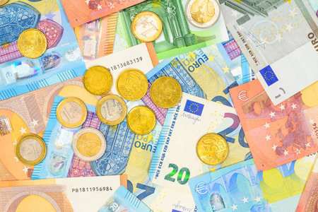 Euro banknotes and coins of different value. Mixed Euro currency money for background and texture....