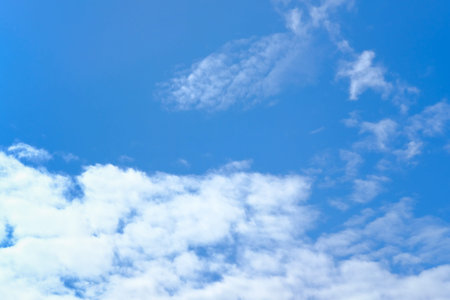 Real blue sky with white clouds. Natural sky background.