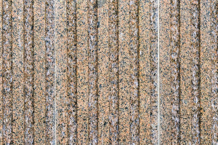 Artificial granite wall background and texture, close up.