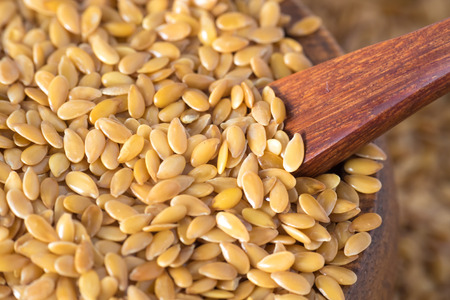 closeup golden flax seed or linseedの写真素材