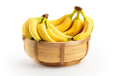 Bunch of bananas in a basket isolated on a white background.の素材